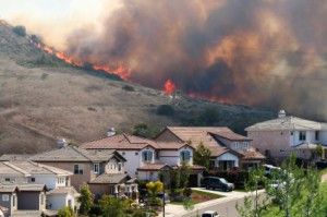 Wild fire in the hills above homes